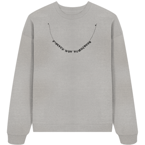 der in kettenform gestaltete schriftzug: einfach nur rumhängen auf einem oversize sweatshirt